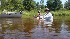 Relaxing during a Silent River Smallmouth tour